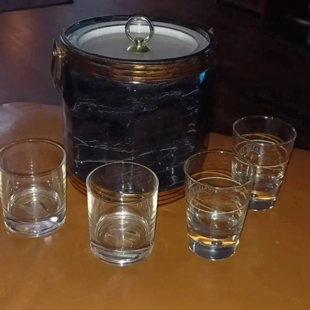Black marble like ice bucket and 2 Bailey's and 2 Ketel One glasses